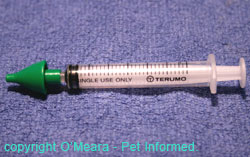 Syringe with intranasal vaccine applicator.